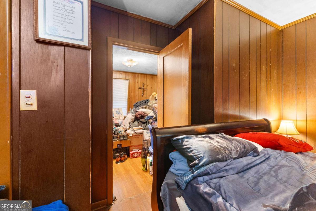 2540 Hannahs Mill Road Thomaston, GA 30286 - Photo 66 of 76 a bedroom with a bed and a mirror