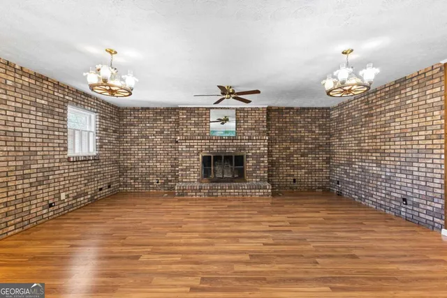 a kitchen with cabinets appliances a sink and a window