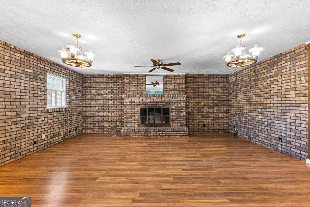 2540 Hannahs Mill Road Thomaston, GA 30286 - Photo 10 of 76 a view of a livingroom with a chandelier