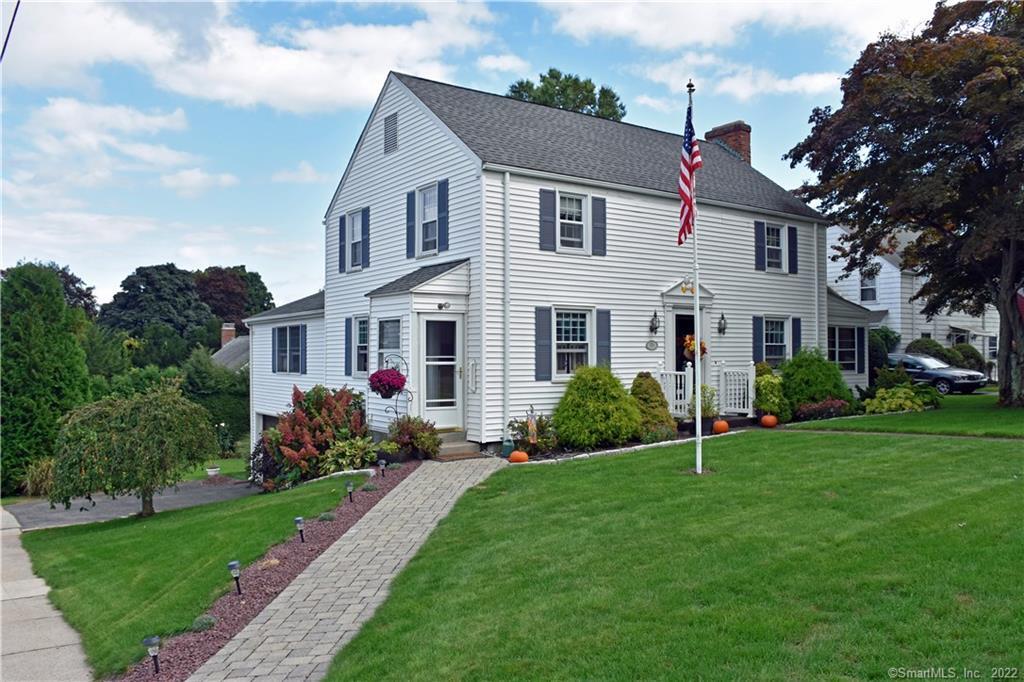 926 Ridge Road Wethersfield, CT 06109 - Photo 1 of 1 a front view of a house with garden and porch