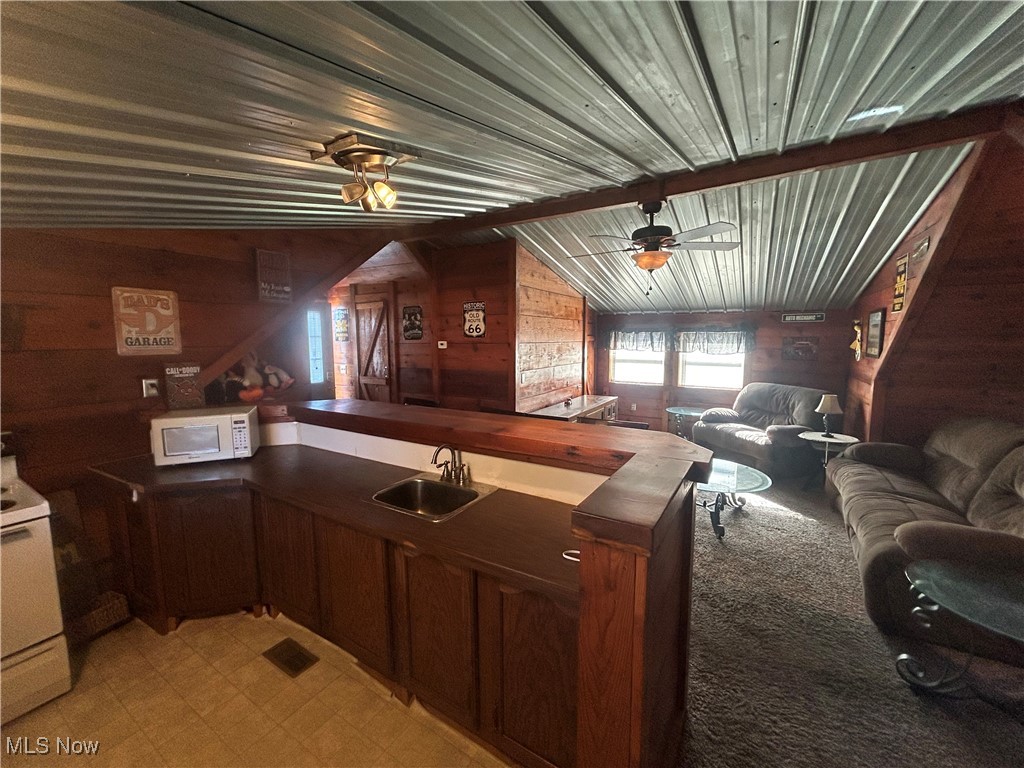 150 West Athens Road Roseville, OH 43777 - Photo 17 of 17 Kitchen with wood walls, wood counters, a ceiling fan, white appliances, and open floor plan