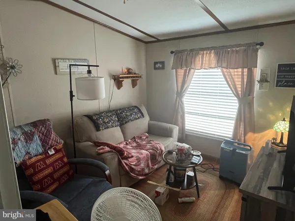 a bedroom with furniture and wooden floor