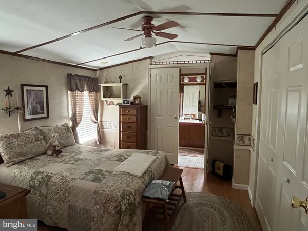 a bedroom with a bed and a walk in closet
