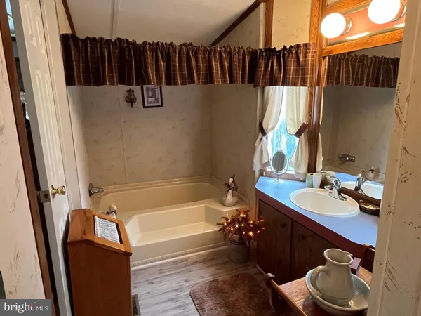 a bathroom with a sink a toilet and a tub