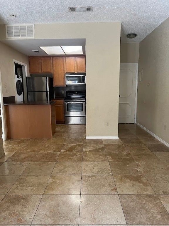 806 West 24th Street, Unit 121 Austin, TX 78705 - Photo 2 of 9 a view of kitchen with refrigerator and cabinets