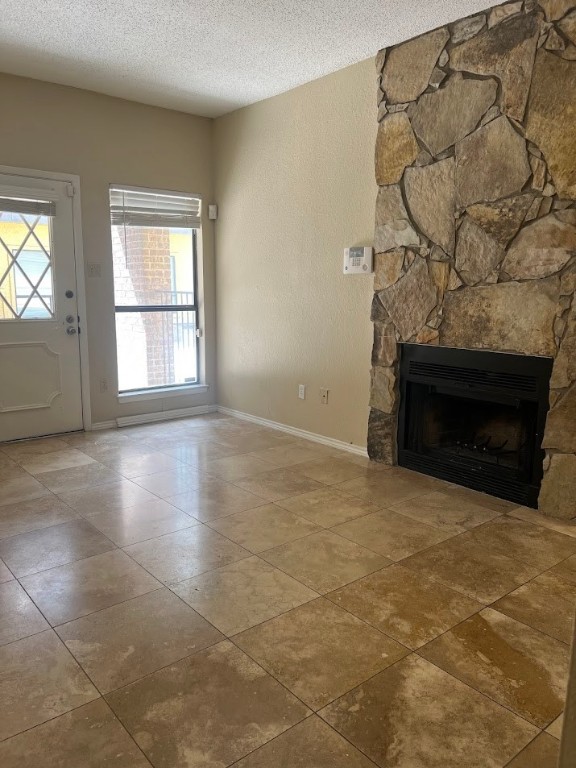 806 West 24th Street, Unit 121 Austin, TX 78705 - Photo 3 of 9 a view of empty room with wooden floor and fireplace