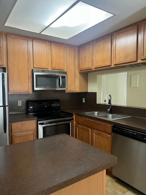 806 West 24th Street, Unit 121 Austin, TX 78705 - Photo 4 of 9 a kitchen with stainless steel appliances a sink stove and microwave