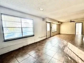 a view of a room with a large window