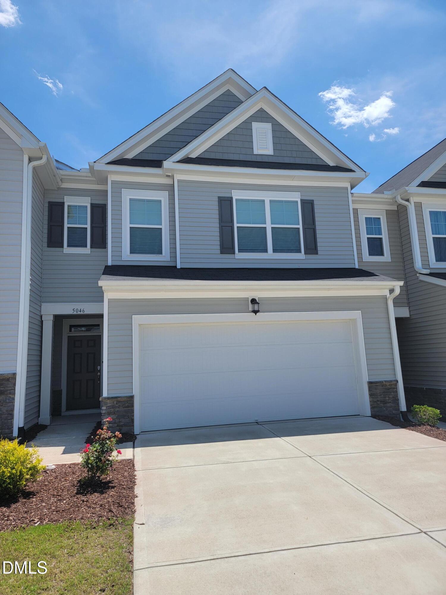 5046 Arkose Drive Raleigh, NC 27610 - Photo 3 of 33 a front view of a house with a yard