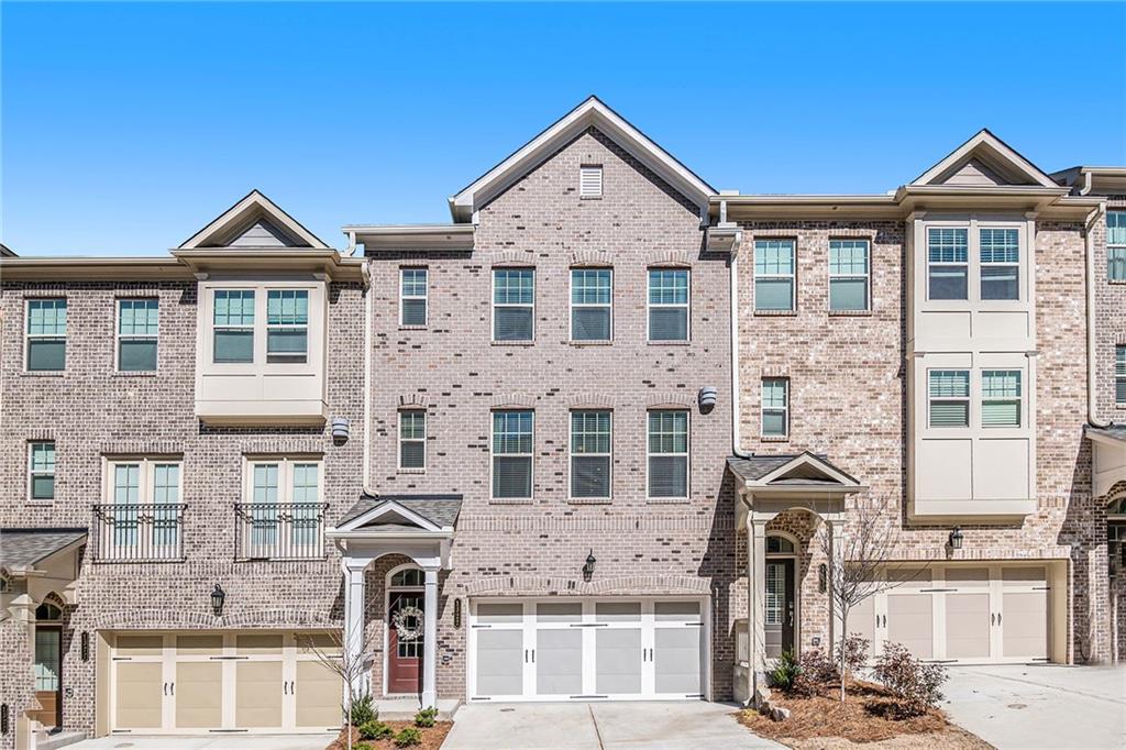 1322 Rosen Road Brookhaven, GA 30319 - Photo 1 of 1 a front view of a residential apartment building with a yard