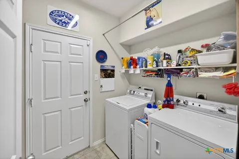a storage room with washer and dryer