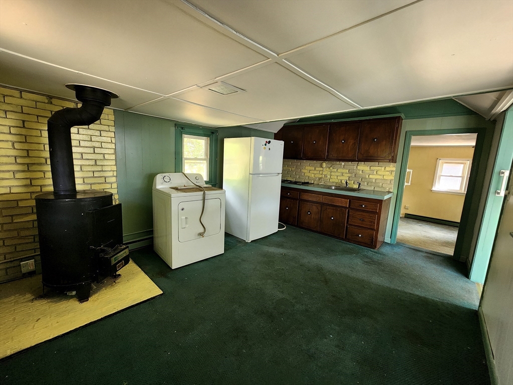 117 High Street Freetown, MA 02702 - Photo 8 of 18 a view of kitchen with refrigerator and window