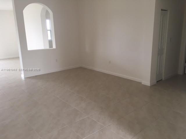 11842 Southwest 253rd Terrace Homestead, FL 33032 - Photo 14 of 15 an empty room with a window