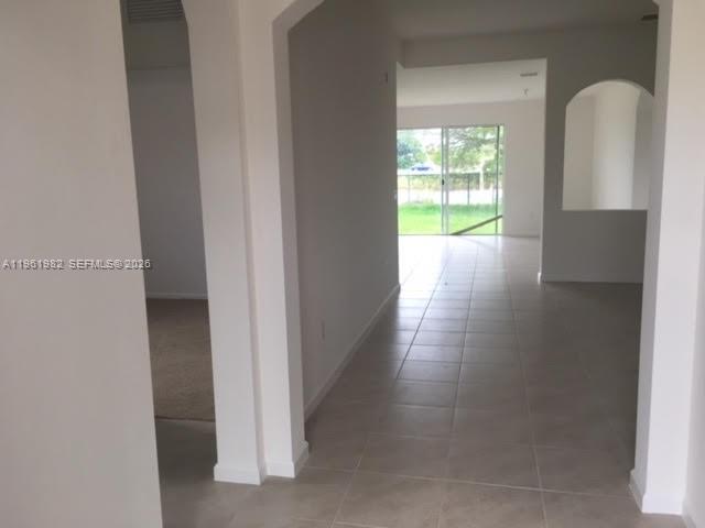 11842 Southwest 253rd Terrace Homestead, FL 33032 - Photo 3 of 15 a view of a room with wooden floor and windows