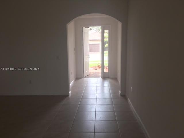 11842 Southwest 253rd Terrace Homestead, FL 33032 - Photo 8 of 15 a view of hallway with wooden floor