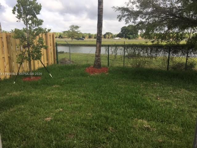 11842 Southwest 253rd Terrace Homestead, FL 33032 - Photo 9 of 15 a lake view with a garden