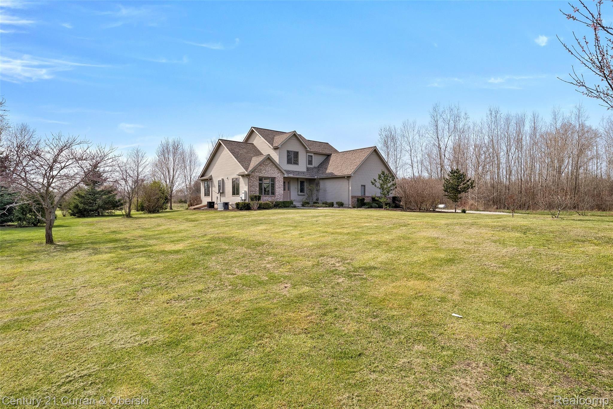 12701 Capernall Road Carleton, MI 48117 - Photo 12 of 45 Front yard and house
