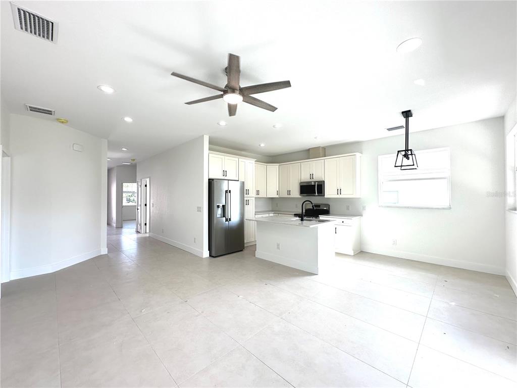 26129 Northern Cross Road Punta Gorda, FL 33983 - Photo 12 of 40 a view of a kitchen with a sink and microwave