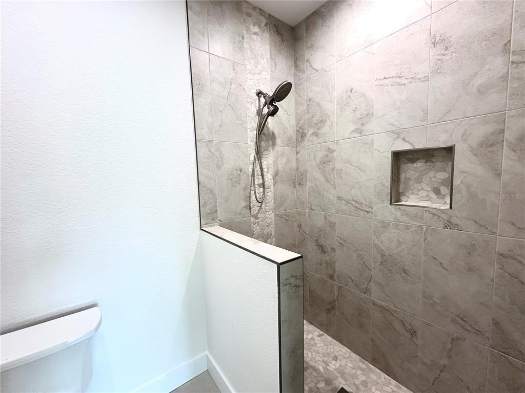 26129 Northern Cross Road Punta Gorda, FL 33983 - Photo 18 of 40 a bathroom with a shower