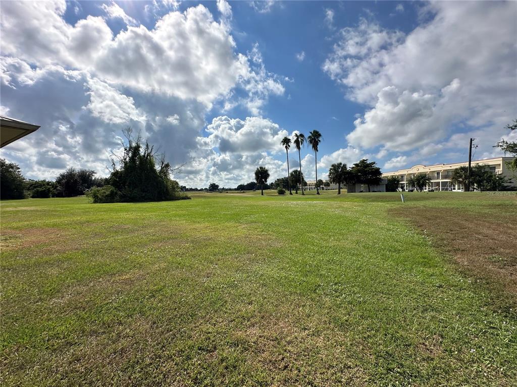 26129 Northern Cross Road Punta Gorda, FL 33983 - Photo 27 of 40 a view of a field with houses in the background