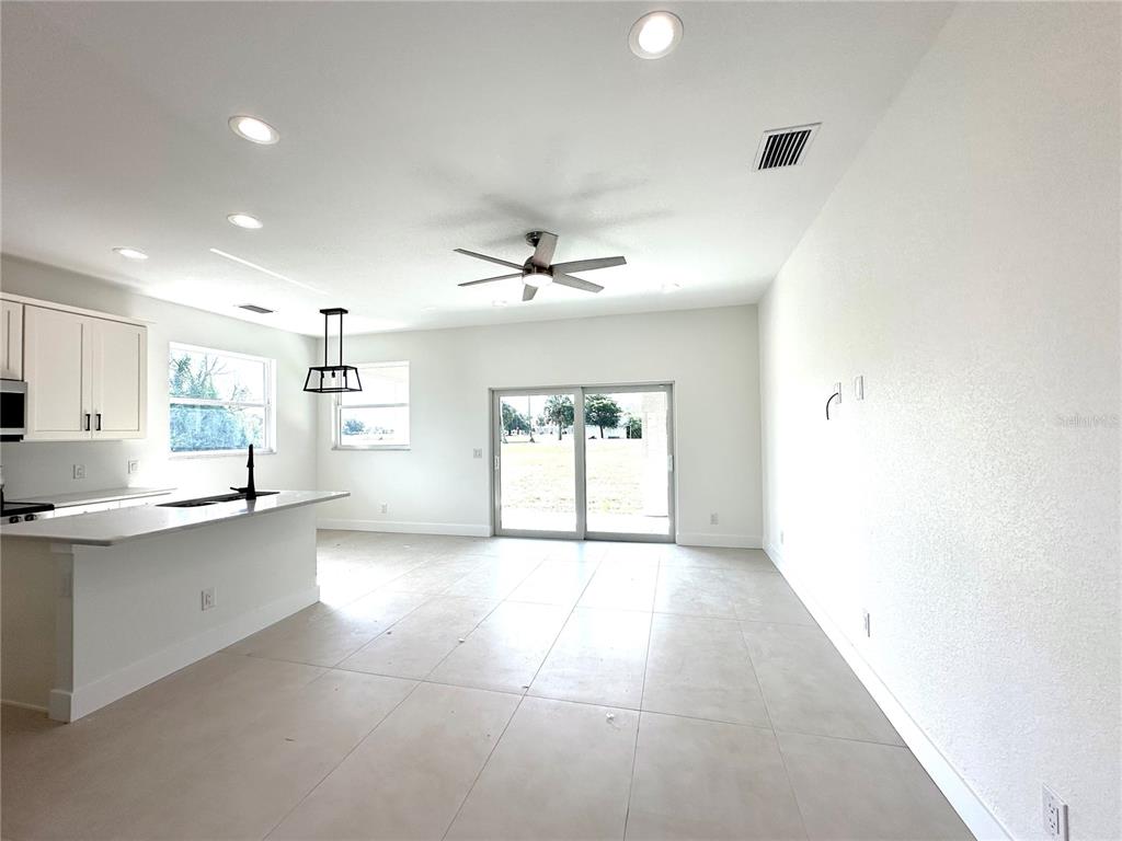 26129 Northern Cross Road Punta Gorda, FL 33983 - Photo 34 of 40 a view of a kitchen with a sink and a window