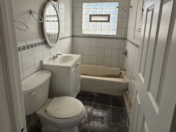 a bathroom with a toilet and a sink