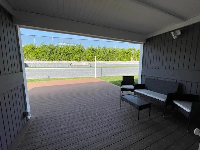 a view of a two chairs in the balcony