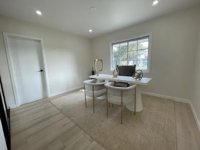 a workspace with furniture and a window