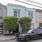 a car parked in front of a house