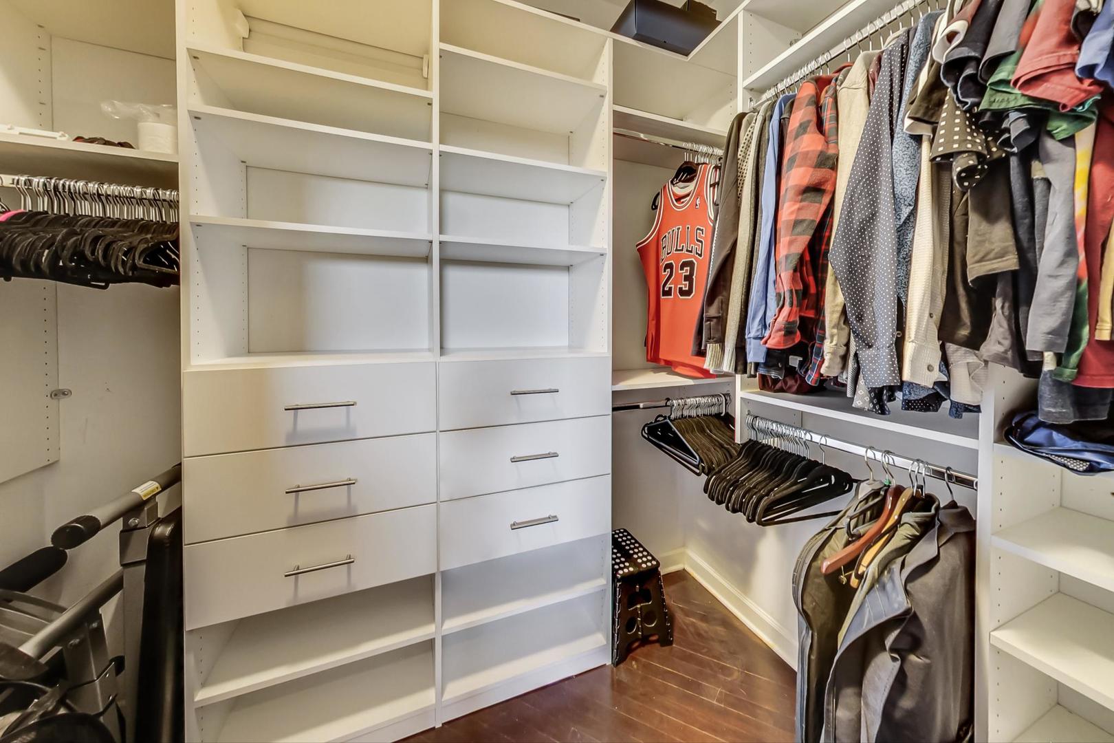 2128 West Walton Street, Unit 3W Chicago, IL 60622 - Photo 17 of 25 a view of walk in closet with clothes and shoes