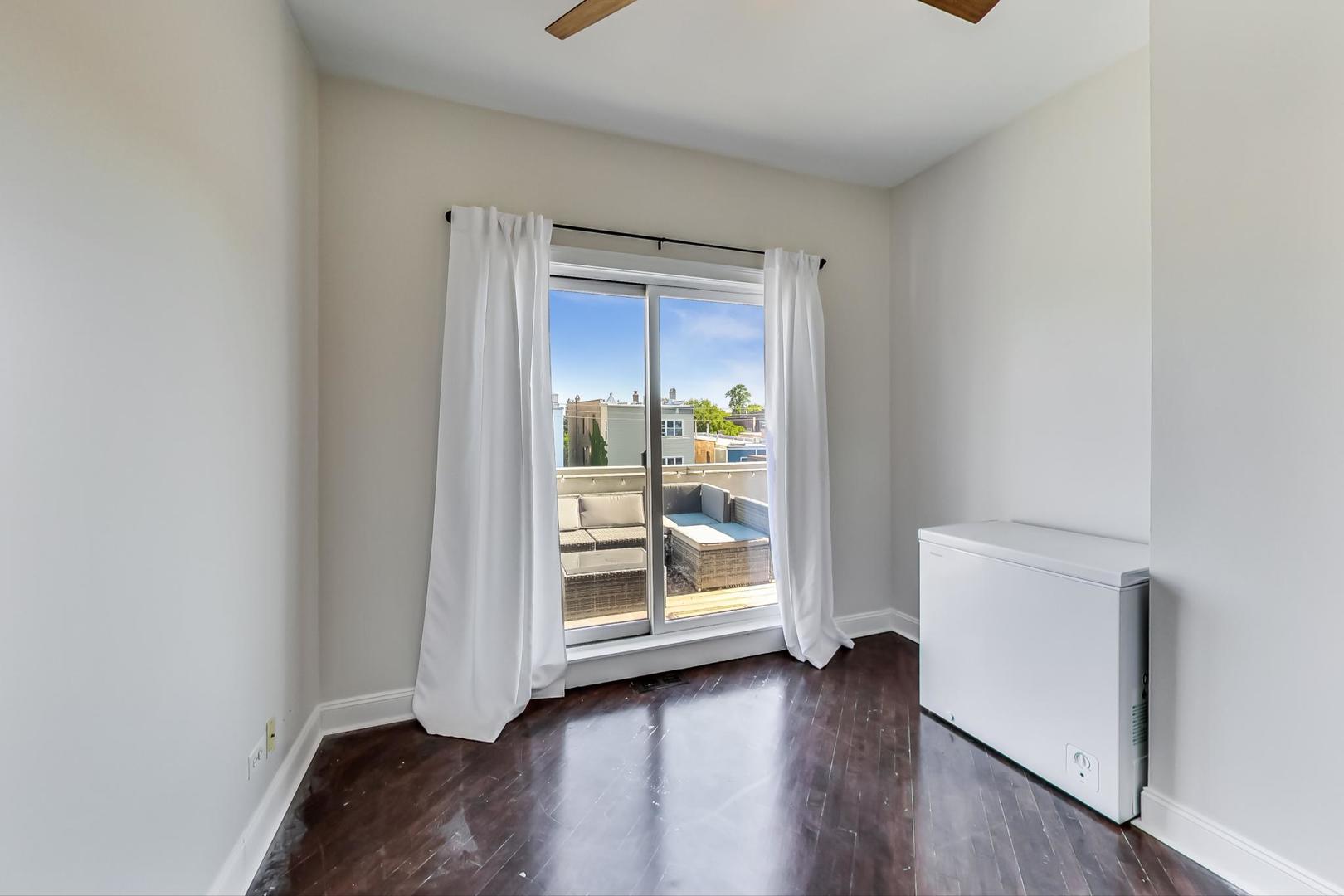 2128 West Walton Street, Unit 3W Chicago, IL 60622 - Photo 10 of 25 a view of an empty room and wooden floor