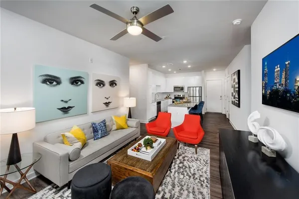 a living room with furniture and a flat screen tv