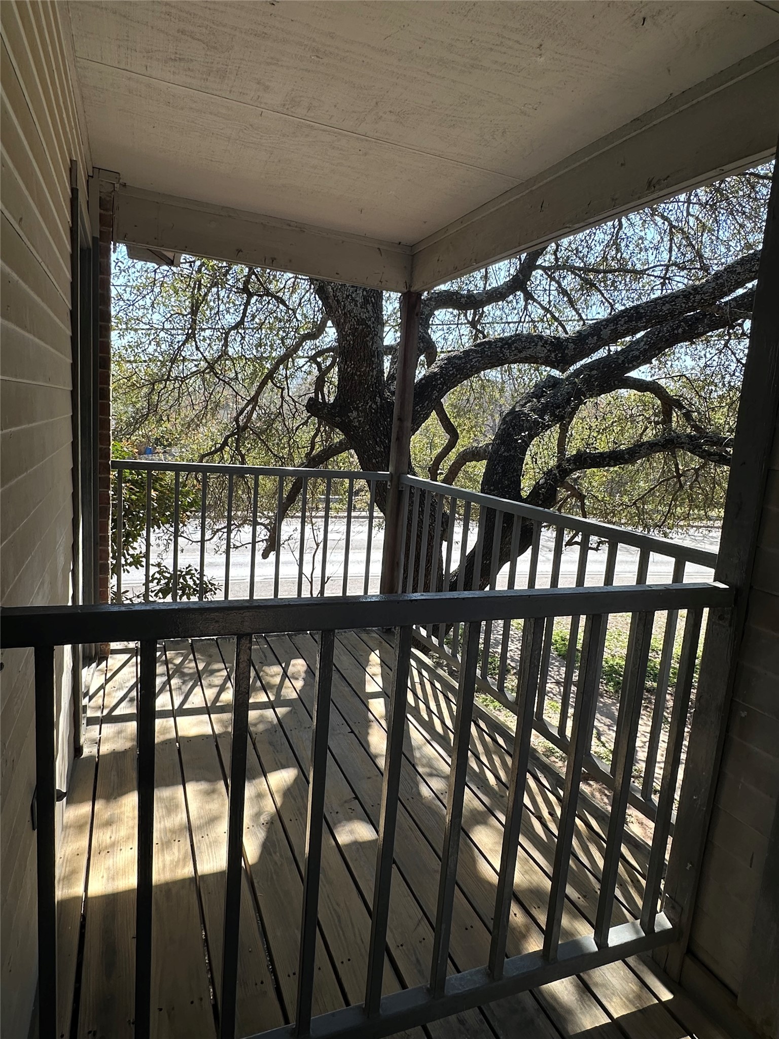 4202 Duval Road, Unit C Austin, TX 78759 - Photo 5 of 5 a view of a porch with a table and chairs