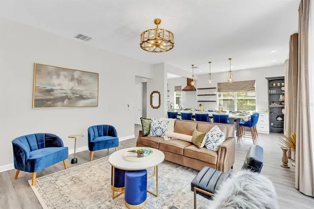 a bathroom with a granite countertop sink a mirror a vanity and shower