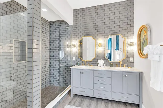 a bathroom with a toilet a sink and shower