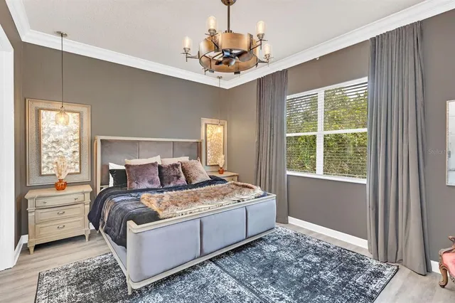 a blue bed sitting in a bedroom next to a blue wall