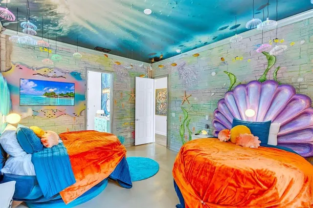 a dining room with furniture and a wooden floor