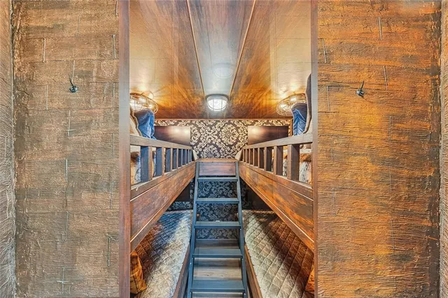 a bedroom with a bed and a night stand