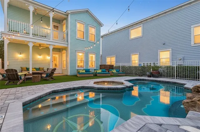 a kitchen with stainless steel appliances a sink a stove and a large window
