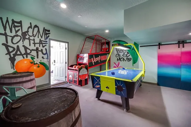 a view of a cafe with a table and chairs under an umbrella