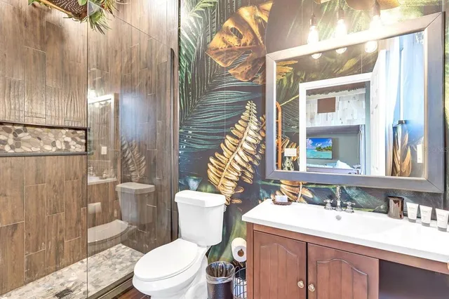 an aerial view of a house with garden space and street view