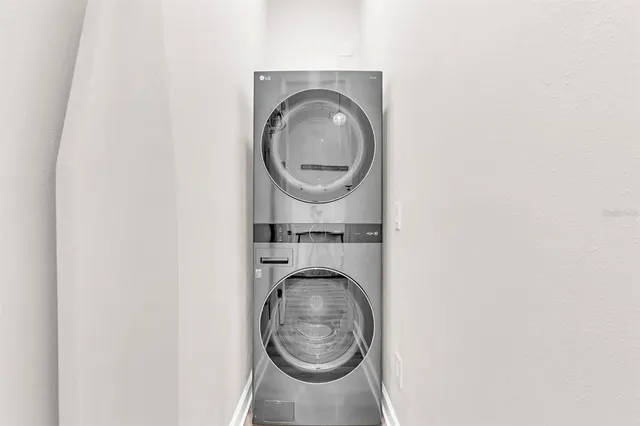 a view of a house with swimming pool and sitting area