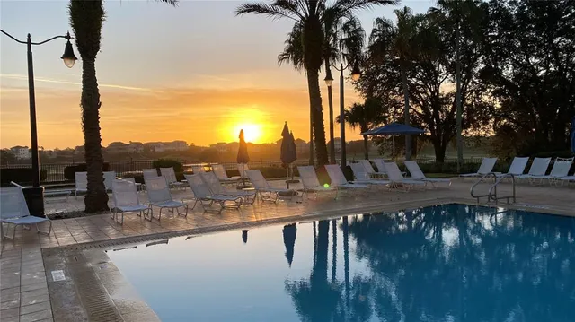 a view of a outdoor with swimming pool and sitting area