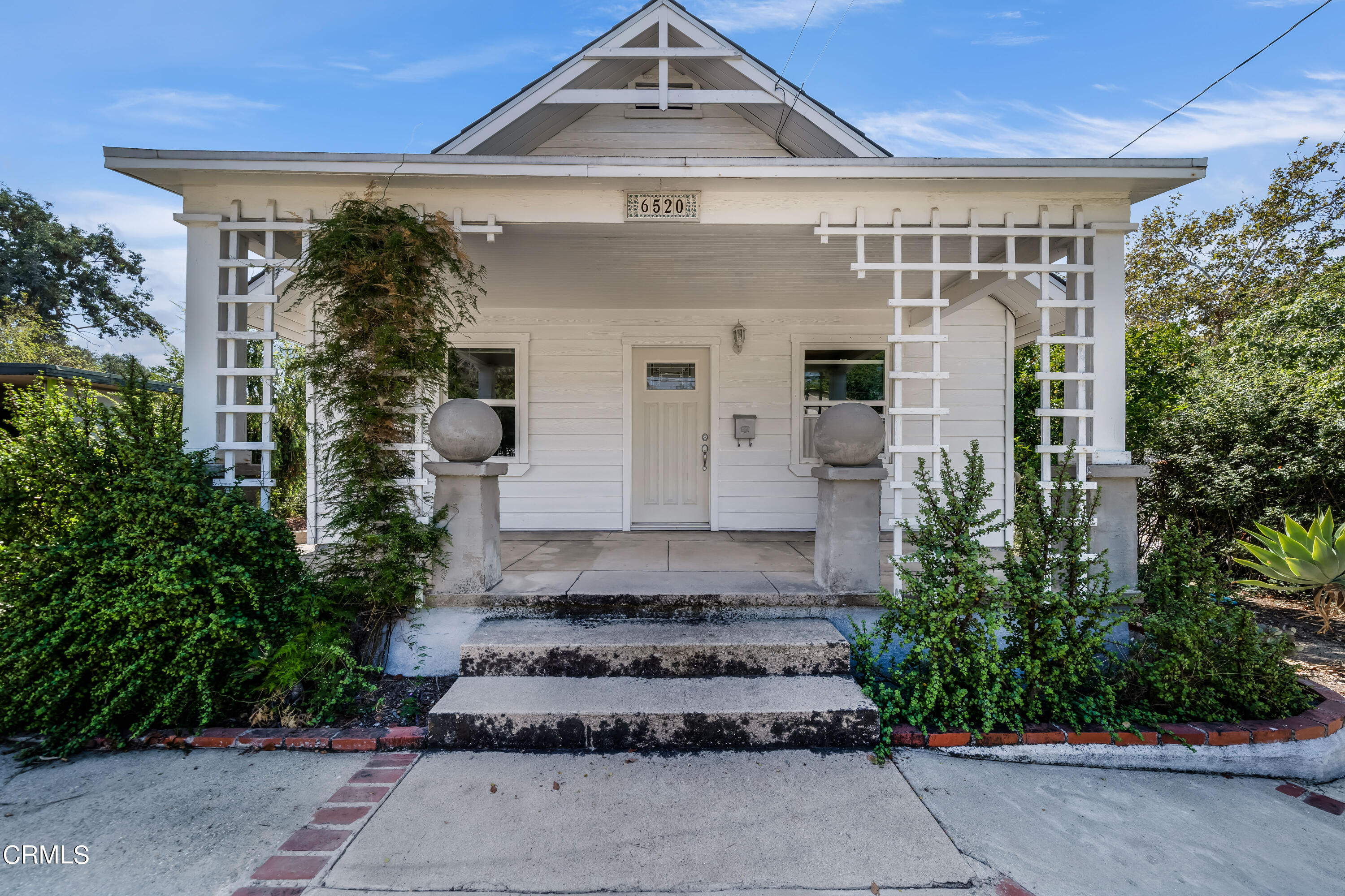 6520 Valmont Street Tujunga, CA 91042 - Photo 11 of 35 a front view of a house with a garden