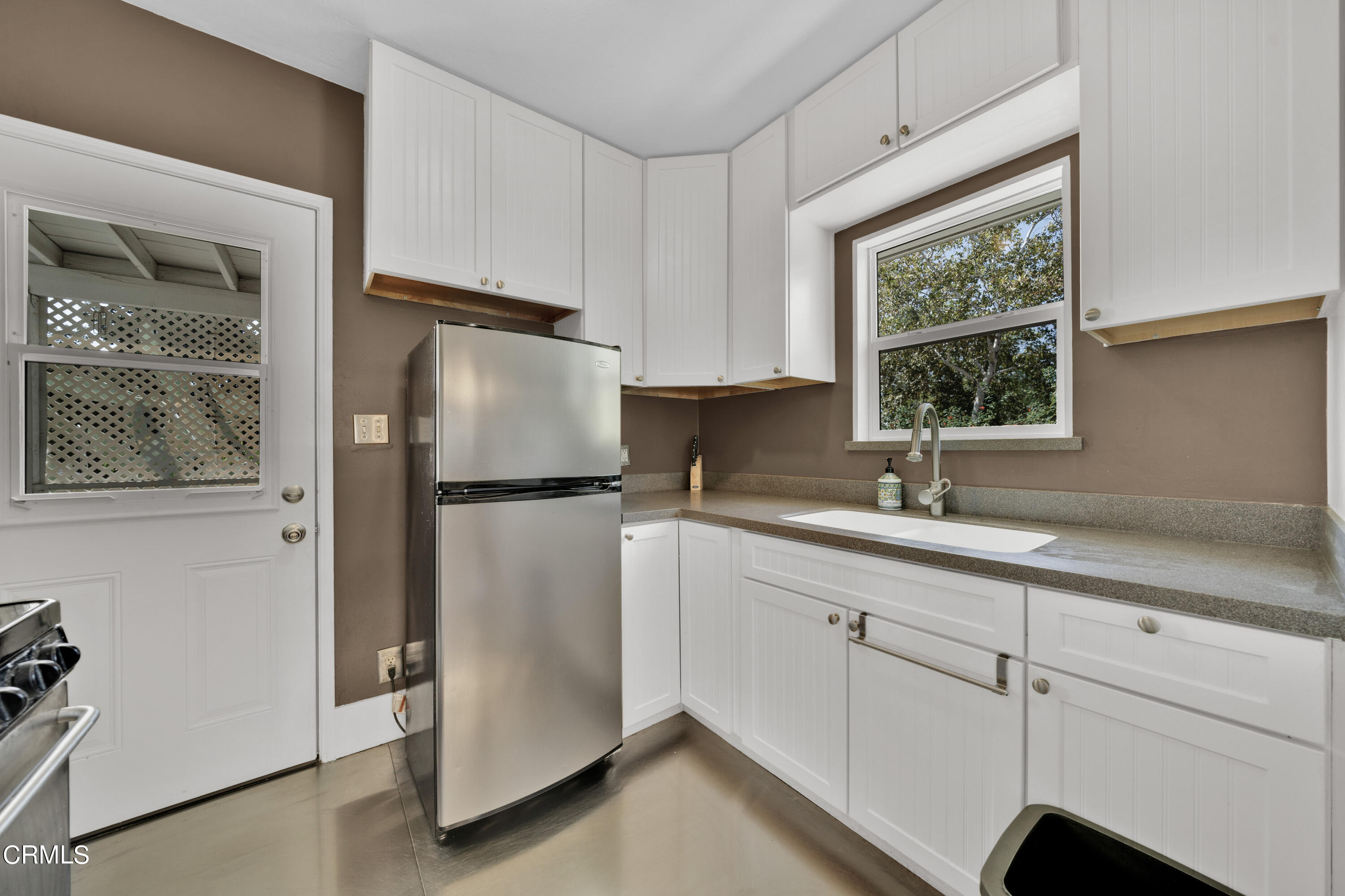 6520 Valmont Street Tujunga, CA 91042 - Photo 19 of 35 a kitchen with a refrigerator and window
