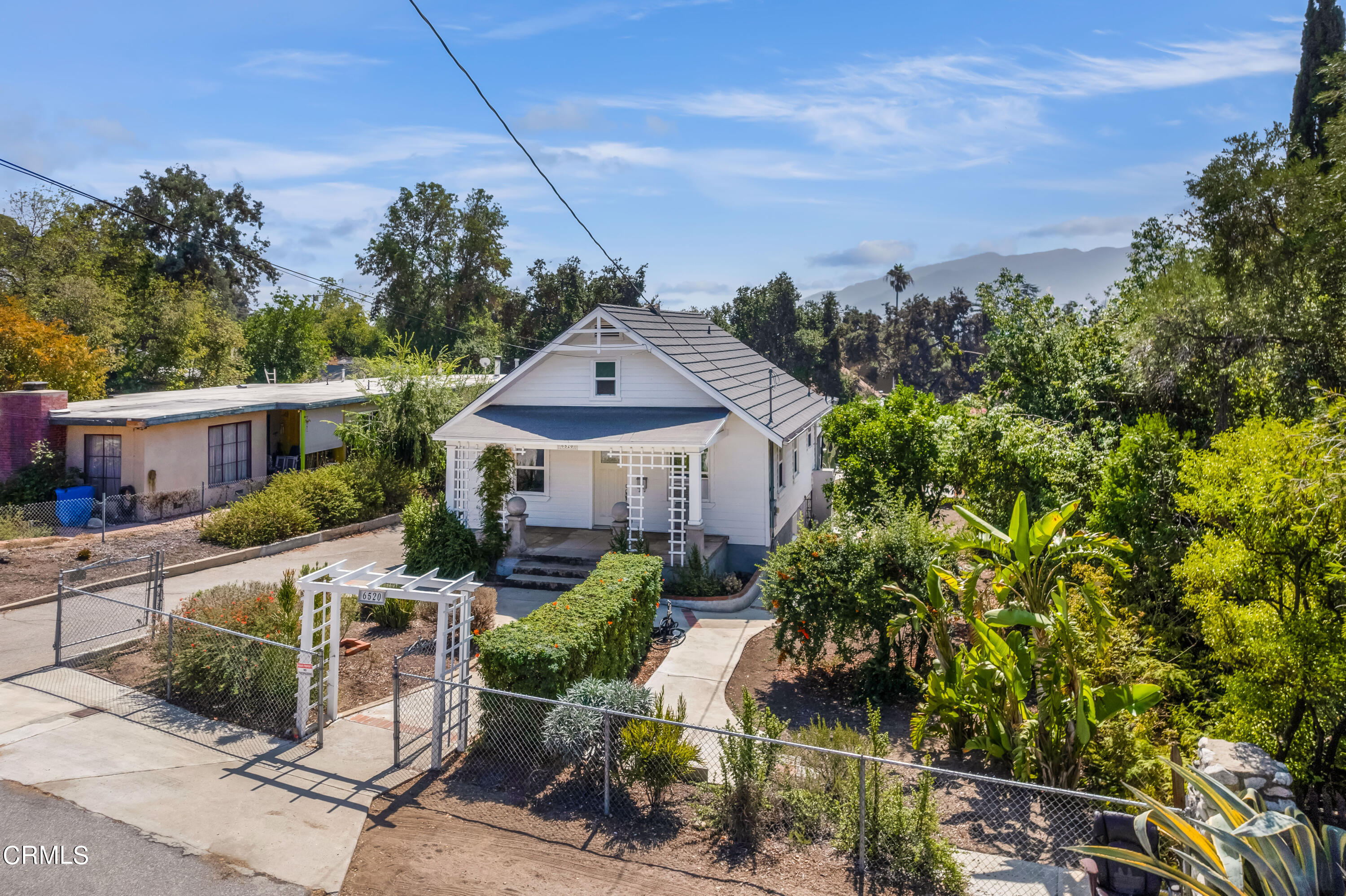 6520 Valmont Street Tujunga, CA 91042 - Photo 2 of 35 a front view of a house with garden