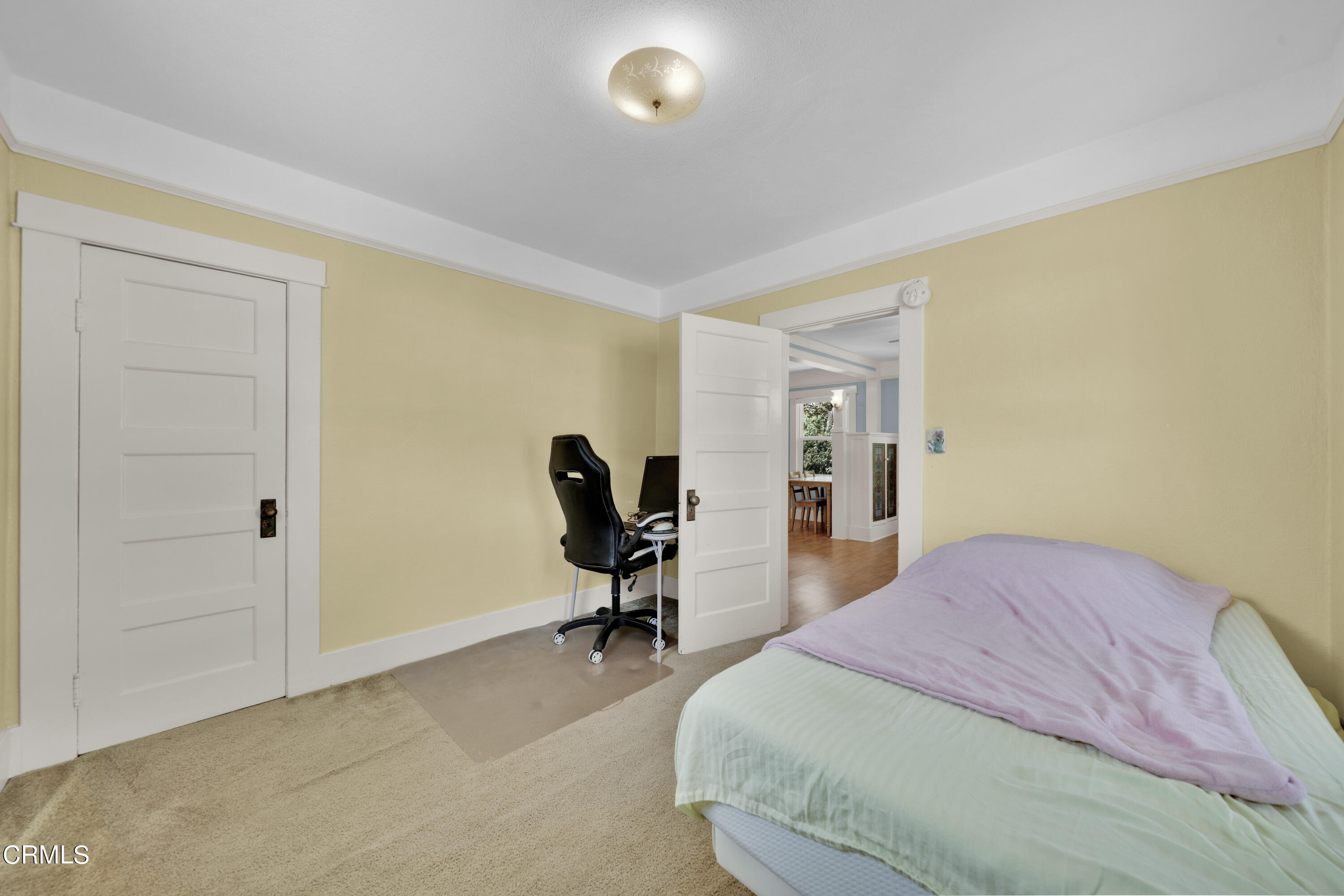 6520 Valmont Street Tujunga, CA 91042 - Photo 21 of 35 a bedroom with a bed and a chair