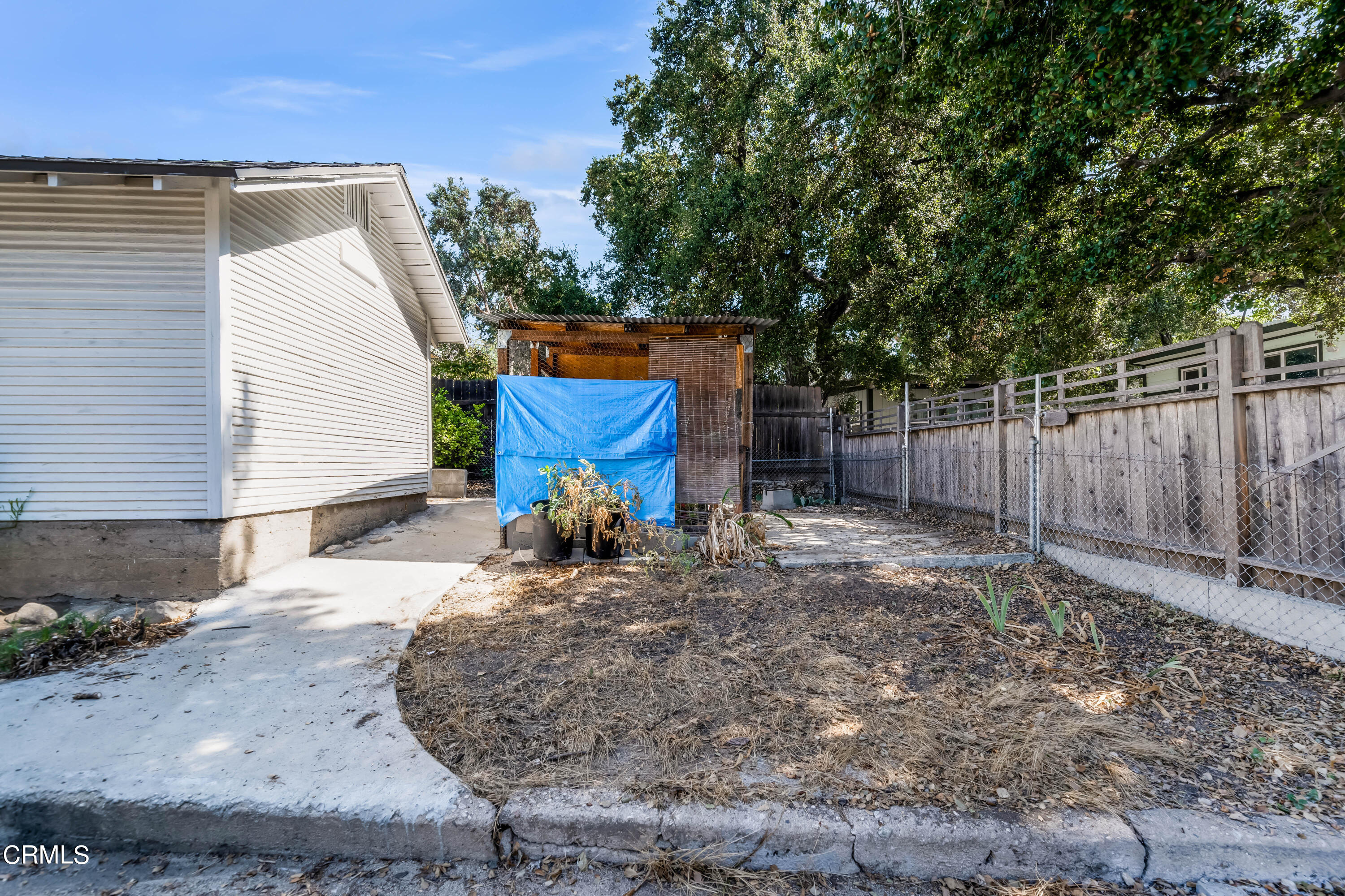 6520 Valmont Street Tujunga, CA 91042 - Photo 29 of 35 a view of a backyard with wooden fence and a large tree