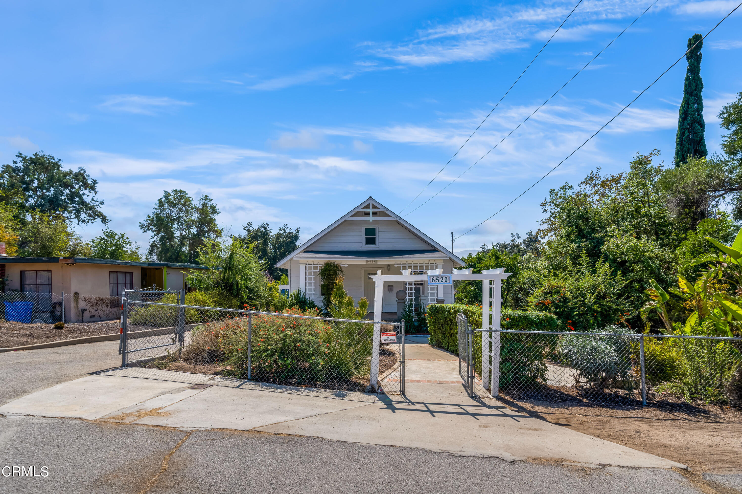 6520 Valmont Street Tujunga, CA 91042 - Photo 7 of 35 a view of a patio with a table and chairs under an umbrella
