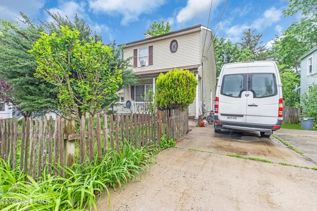 a view of backyard with a patio